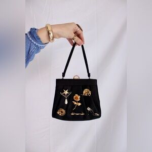 Elegant Black Handbag with Brooches